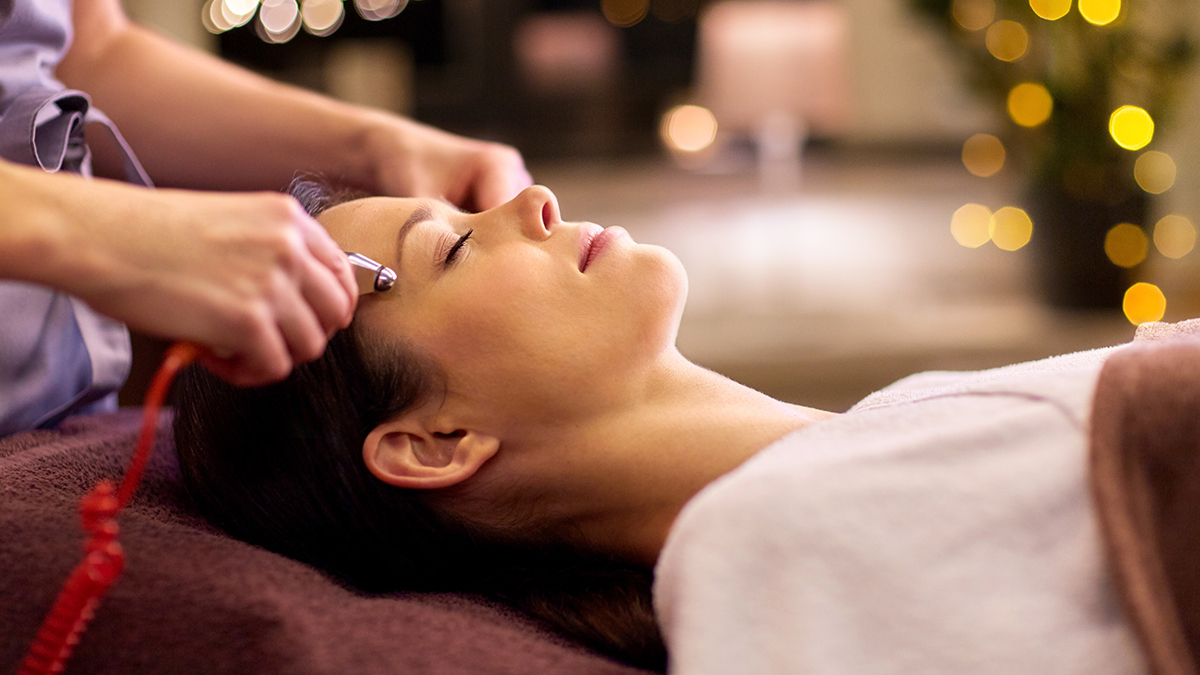 A beautiful woman getting a microcurrent facial